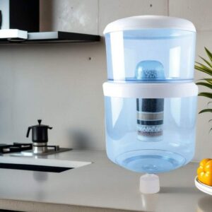 Large countertop double-tiered gravity water filter dispenser in a kitchen setting